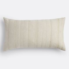 a white striped pillow on a gray background