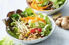 two bowls filled with different types of vegetables