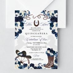 a wedding card with an image of boots and flowers on it, next to a white envelope