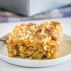 a piece of cake sitting on top of a white plate with a fork in it