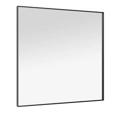 a mirror that is on the wall in front of a white background and black frame