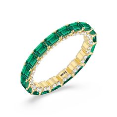 This eternity ring showcases a stunning balance between vintage glamour and feminine romance. It features emerald-cut created Emerald in an east-west setting evoking Art Deco's architectural splendor. Each emerald-cut diamond is set on a thick U-shaped prong punctuated by a pair of petite round diamonds on its side. The curved yellow gold prongs form a circle and makeup the graceful, scalloped base of the band. Classy Wear, Gorgeous Engagement Ring, Stacked Bangles, Bangle Designs, Emerald Gemstone, Emerald Cut Diamonds, Vintage Glamour, East West, Diamond Earrings Studs