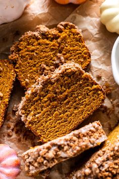 slices of pumpkin bread sitting on top of parchment paper