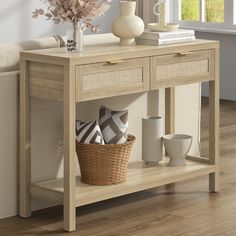 a wooden table with baskets and vases sitting on it's shelf next to a window