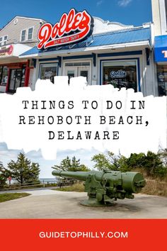 an old cannon sitting in front of a store with the words things to do in rehobot beach, delaware