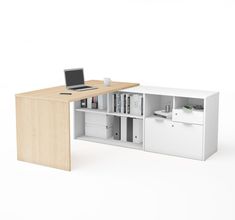 an office desk with bookshelves and a laptop on it