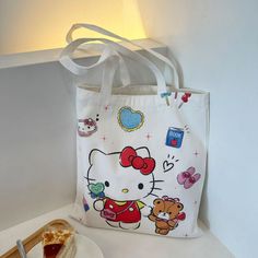 Step into a world of adorable charm with our Kawaii Cartoon Sanrio Character Print Tote Bag, the ultimate accessory for any anime enthusiast or lover of all things cute. This canvas bag features vibrant and delightful Sanrio characters that will bring joy to your everyday errands, making it not just a tote but a statement piece that stands out in any crowd. Hello Kitty Canvas, Hello Kitty Bag