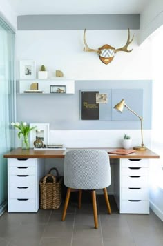 a desk with some drawers and a chair in front of it on top of a tile floor