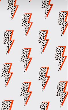 an orange and black lightning bolt pattern on a white background with polka dotty dots