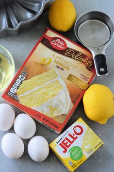 the ingredients for lemon cake are laid out on the counter next to an egg shell