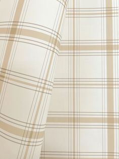 a close up view of a plaid pattern on a white sheet cover with tan and beige stripes