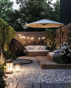 an outdoor seating area is lit up with lights