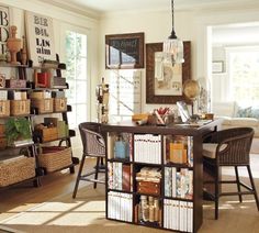 a living room filled with furniture and lots of books