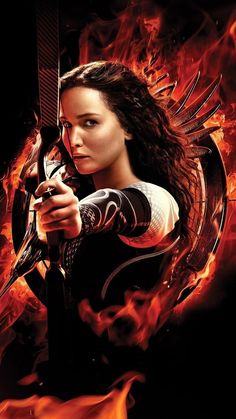 the poster for the movie's upcoming film, catching fire with her bow and arrow