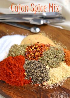 various spices and seasonings on a wooden board