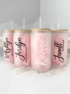 three pink tumblers with the words happily married on them