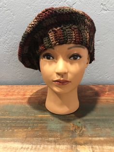 Hand crocheted multi-colored deep earth toned beret style hat. Lightweight acrylic yarn. Brown Bohemian Crochet Cap, Bohemian Brown Yarn Beanie, Brown Bohemian Beanie One Size, Multicolor Flat Cap For Fall, Bohemian Brown Beanie, Bohemian Brown Knitted Beanie, Brown Bohemian Crochet Beanie Hat, Bohemian Brown Crochet Beanie Hat, Brown One Size Beret For Winter