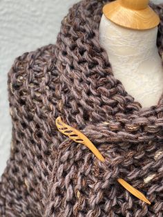 Hand knitted Outlander inspired shawl, scarf, shoulder wrap, neck warmer in marled brown with a hint of pale purple. - triangle design, can be worn in many different ways - one size fits all - made with 1 tassel, please let me know if you prefer 3 tassel (on each tip) or no tassels - super soft 50% acrylic, 30% wool, 20% mohair yarn - available in any color or yarn imaginable, please contact me for custom orders - made in smoke and pet free environment CARE: Hand wash , air dry. Brown Crochet Shawl For Fall, Fall Crochet Brown Shawl, Cozy Brown Shawl One Size, Cozy One-size Brown Shawl, Brown Knitted Shawl For Fall, Brown Hand Knitted One Size Knitting Pattern, One Size Hand Knitted Brown Knitting Pattern, One Size Brown Hand Knitted Pattern, Cozy Brown Yarn Knitting Pattern