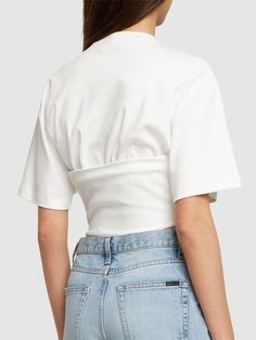 Corset structure at hem with front with lace-up closure. Model is wearing a sizeS Fitted White Top With Cropped Hem, Fitted White Cropped Top, White Fitted Top With Cropped Hem, White Fitted Crop Top With Cropped Hem, White Cotton Cropped Hem Top, White Cropped Cotton Top, White Cotton Cropped Top, Fitted Cropped Top For Spring, Spring Cropped T-shirt