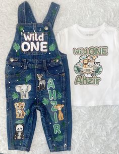 Custom Safari Birthday overalls with shirt. Can be made for a BOY or a GIRL as well as ANY CHARACTER or THEME. Production time is now 3-4 WEEKS so please order in a timely manner.  If you need it before 3 WEEKS, a "Rush Order Fee" is REQUIRED & does NOT include shipping. This option is listed on my shop & has to be added to your cart.  Outfits aren't guaranteed to stay intact if washed or dried, so please be mindful of this. This is typically a one time wear outfit. *Please note that no outfit w Wild One Birthday Outfit Boy, Safari Birthday Party Outfit, Wild One Birthday Party Boys, First Birthday Boy Outfit, Birthday Overalls, 1st Birthday Boy Themes, Boys Birthday Outfits, Safari Dress, Party Themes For Boys