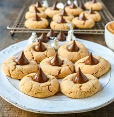 some cookies are on a white plate with chocolate