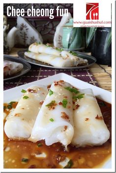 some food is on a white plate with sauce and green garnish around it