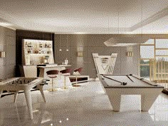 a pool table in a room with lots of windows