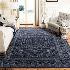 a living room with a blue rug on the floor