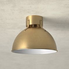 an overhead light fixture on a wall