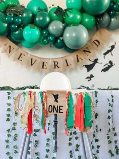 a table with some balloons and decorations on it