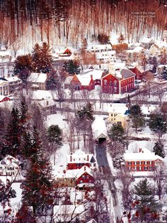 an aerial view of a small town in the snow