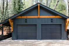 two garages in the middle of a wooded area