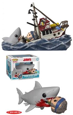 two toys that are next to each other in the water and one has a shark on it