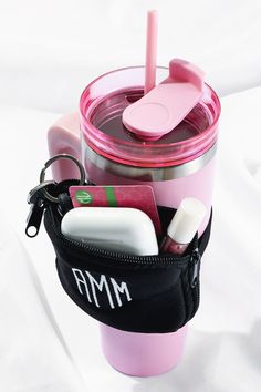 a pink cup filled with personal care items