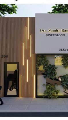 the entrance to an office building with plants growing on it