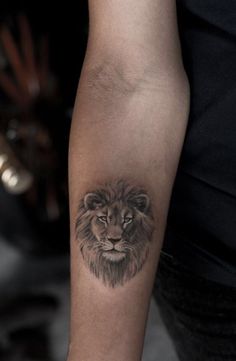 a lion tattoo on the arm