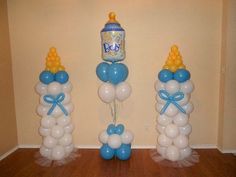 balloons and decorations for a baby's first birthday in blue, yellow and white