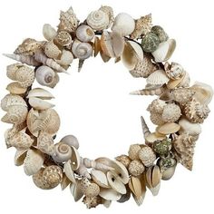 a wreath made out of seashells on a white background