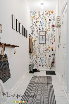 the hallway is decorated with colorful wallpaper