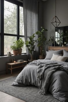 a large bed sitting next to a window with plants in the corner on top of it