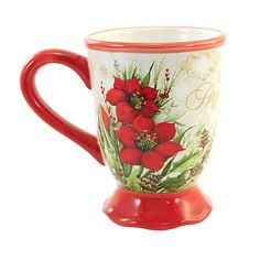 a red coffee mug with flowers painted on it