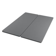 two gray mats sitting side by side on top of each other in front of a white background