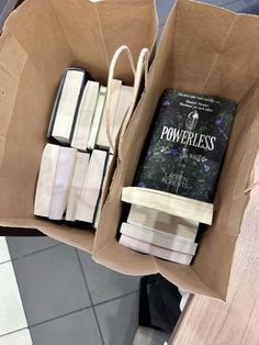 a box filled with books sitting on top of a table