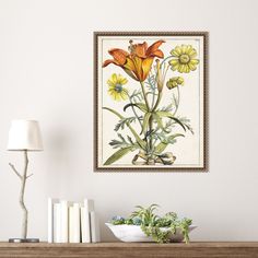 a painting hanging on the wall next to a table with books and flowers in it