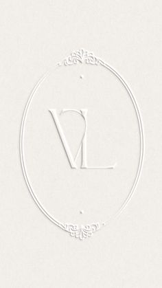 a white logo with the letter v in it's center and an ornate frame around it