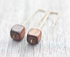 Modern and beautiful chunky hand formed and hammered brass geometric dangle earrings with  natural ebony wood cube beads. Perfect for everyday wear.Measure about 2 inches (50mm).Ebony wood cubes measure approx. 10mmEach pair of earrings is handmade and slightly unique, please keep in mind that yours won't be identical to the photo but very similar.♥ Thank you for looking! ♥♥♥♥♥♥♥♥♥Enter my shop here:http://www.etsy.com/shop.php?user_id=5562123 Wood Cube, Jewelry Minimal, Wood Jewelery, Cube Beads, Wood Bracelet, Ebony Wood, Minimal Chic, Geometric Jewelry, Modern Earrings