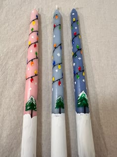 Only 1 Candle: 15$ Hand Painted Snowy Scape Candle Color: pink , Blue , dark blue Made to order Turnaround time is 1-3 days Burning time is 5.5 h All candles come with wrapped. Holiday Candle Painting, Diy Painted Candles, Candle Stick Painting Christmas, Candle Painting Christmas, Candles Painting, Painted Taper Candles Diy, Diy Painting Candles, Candle Painting Ideas, Candle Painting