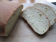 a loaf of bread sitting on top of a cutting board