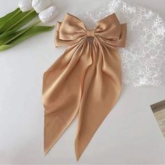 Beige Hairbow Tan / Gold/ Goldenrod Satin Finish With Long Tails. Trending Style! New! Secure Spring Clip / Barrette Style Closure Please See Sample Photo For Measurements. #Beigebow #Goldbrown #Goldbow #Tanbow #Pretty #Hairbow #Hair #Barrette #Bigbow #Mediumbow #Satinbow #Trendybow #Hairbow #Longtailbow #Longhairbow #Stylebow #Trendinghairbow #Trendingbow #Largebow 12172301 Gold Hair Bow, Trendy Bows, Nepo Baby, Hair Ribbon, Silk Hair, Ribbon Hair, Gold Hair, Elegant Hairstyles, Satin Bow