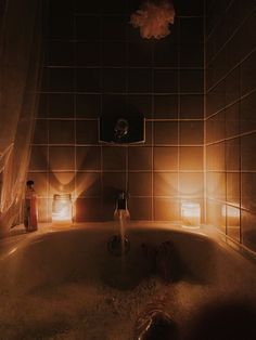 a bathtub with lights shining on the walls